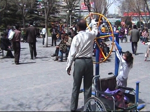 Adult playground. The man next to Yanmei has a wheelchair!