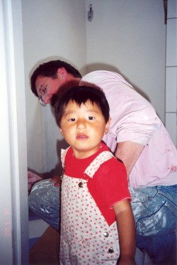 Yanmei helping Steven put up tiles in the bathroom - May 2000