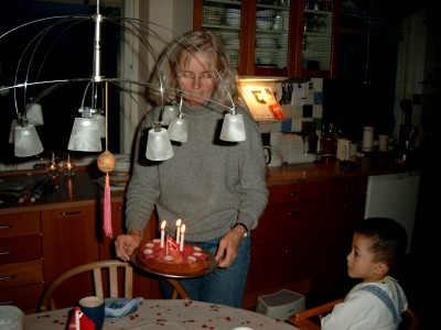 Lene bringing Daji his 3 year birthday cake