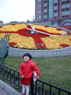 Yanmei in front of a flower clock, just across from our hotel