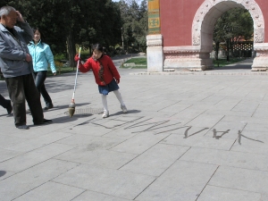 Yanmei writing her name in water