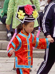 Girl in a national dress. She'd just posed for a photo - the clothes are clothes you loan and have your pictures taken in.