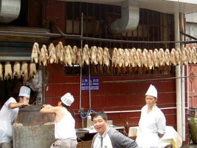 Ducks hanging - just before they become Pekin Duck