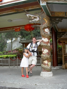 Steven and Yanmei pose next to an impressive decorated column