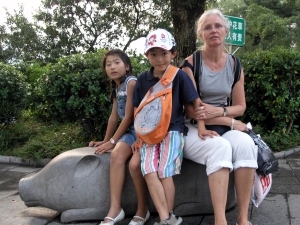 Sitting on a pig in the town park in Guilin