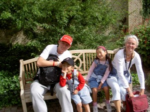 A tired family taking a rest halfway through the 15km charity walk 