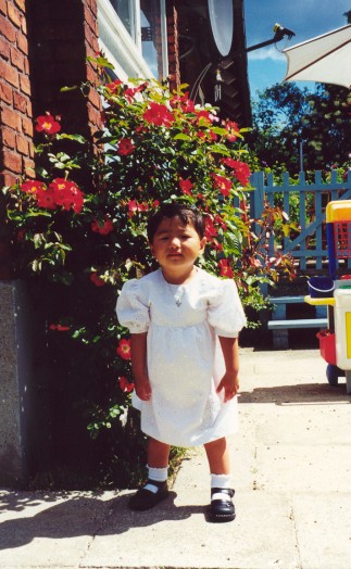 Yanmei in her baptism dress